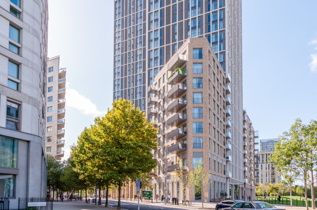 Modern apartment buildings in central location with trees